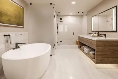 a white bathroom with a tub and a sink at Kindred Resort Luxury Ski In, Ski Out 2 Bedroom Residence At The River Run Gondola in Dillon