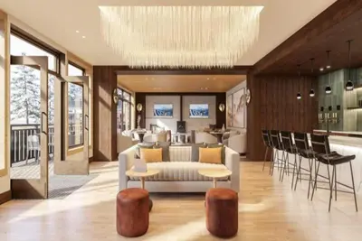 a living room with a couch and a table and chairs at Kindred Resort Luxury Ski In, Ski Out 2 Bedroom Residence At The River Run Gondola in Dillon