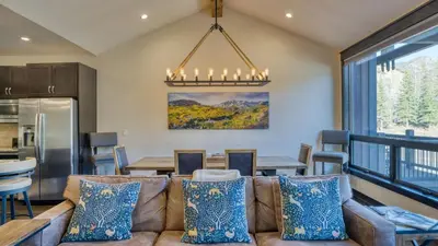 a living room with a couch and a table at Fireplace Game Room Mountain Views Near Golf Dining Keystone River Run by AvantStay in Dillon