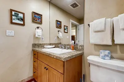 a bathroom with a sink and a toilet at Base Camp One 413 in Granby