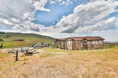 an apartment building in the middle of a field at Base Camp One 314 in Granby