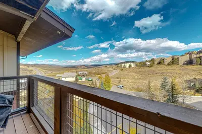 a balcony with a view of the mountains at Base Camp One 314 in Granby