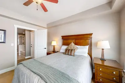 a bedroom with a bed and a ceiling fan at Base Camp One 316 in Granby
