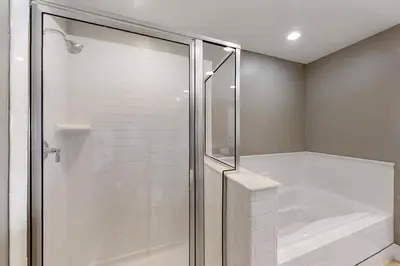 a bathroom with a shower with a glass shower stall at Base Camp One 316 in Granby