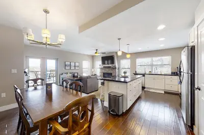 a kitchen and dining room with a table and a kitchen and a dining room at Base Camp One 316 in Granby