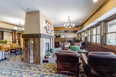 a living room with a fireplace and furniture at Base Camp One Penthouse 416C in Granby