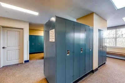 a locker room with blue lockers and a door at Base Camp One Penthouse 416C in Granby