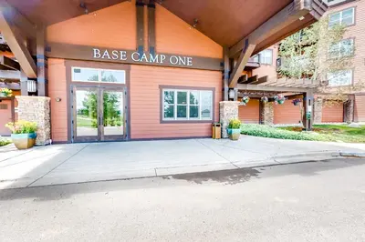 a large orange building with a base camp one sign on it at Base Camp One Penthouse 416C in Granby