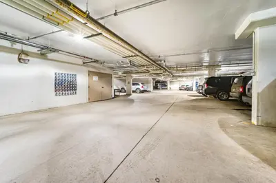 an empty parking garage with cars parked in it at Base Camp One 412 in Granby