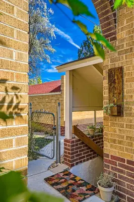 a garage with awning on the side of a building at Sloans Lake Basement Suite in Denver