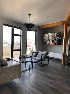 a living room with two couches and a table at Luxe 2BR condo in Denver's Rino Art District in Denver