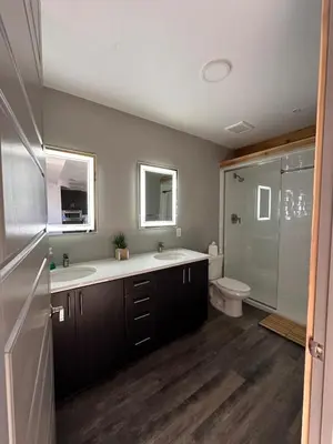 a bathroom with a tub and a sink and a toilet at Luxe 2BR condo in Denver's Rino Art District in Denver