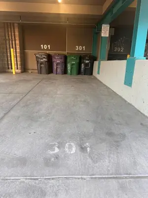 an empty parking garage with the number on the floor at Luxe 2BR condo in Denver's Rino Art District in Denver