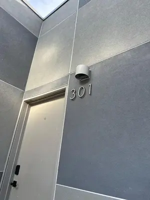 a door with a number on the side of a building at Luxe 2BR condo in Denver's Rino Art District in Denver