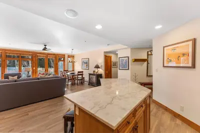 a kitchen and living room with a couch and a table at Timbers 3080 in Keystone