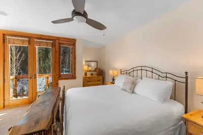 a bedroom with a bed and a ceiling fan at Timbers 3080 in Keystone