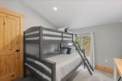 a bedroom with two bunk beds in a room at Mountain View Retreat- Private Hot Tub & Views in Bailey