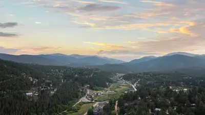 a view of a valley with mountains in the distance at Mountain View Retreat- Private Hot Tub & Views in Bailey