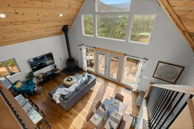 an overhead view of a living room with large windows at Mountain View Retreat- Private Hot Tub & Views in Bailey