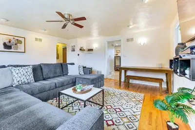 a living room with a couch and a table at Walk to Old Town Lafayette! Cozy Couples Escape in Lafayette