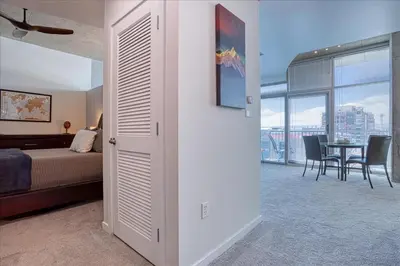 a bedroom with a bed and a table with chairs at Sunset View in Denver
