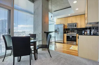 a kitchen with a table and chairs in a room at Sunset View in Denver