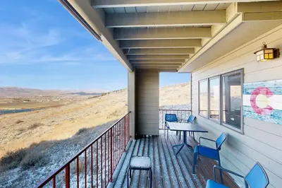 a balcony with a table and chairs and a view at Granby Vista Getaway in Granby