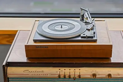 a record player with a cd on top of it at Downtown Denver Suite - Skyline Views in Denver
