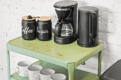 a table with coffee makers and cups on it at Downtown Denver Suite - Skyline Views in Denver