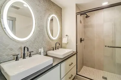 a bathroom with two sinks and a shower at Timber Fox 2207 condo in Winter Park