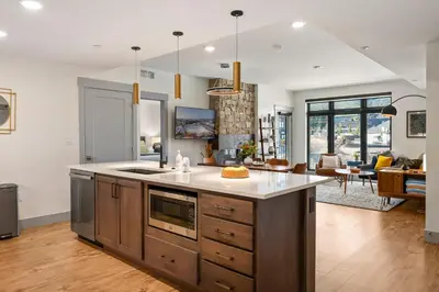 a kitchen with an island in the middle of a room at Timber Fox 2207 condo in Winter Park