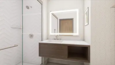 a bathroom with a sink and a mirror and a shower at Holiday Inn & Suites Commerce City - Denver Airport by IHG in Commerce City