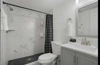 a bathroom with a shower and a toilet and a sink at Colorado Retreat in Westminster