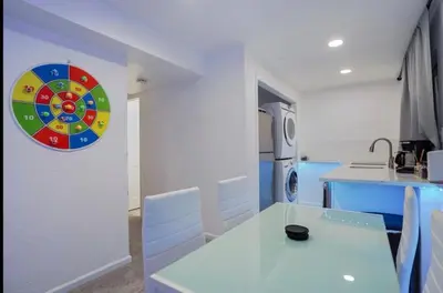 a kitchen with a table and a dart board on the wall at Colorado Retreat in Westminster