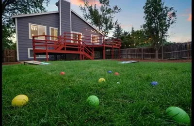 a house with a yard with balls in the grass at Colorado Retreat in Westminster