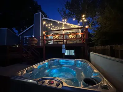 a hot tub in front of a house at night at Colorado Retreat in Westminster