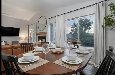a dining room with a table and a large window at Colorado Retreat in Westminster