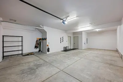 an empty room with white walls and concrete floors at 50 East 6th Ave A3 in Silverthorne