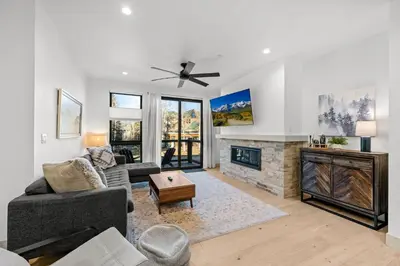 a living room with a couch and a fireplace at 50 East 6th Ave A3 in Silverthorne
