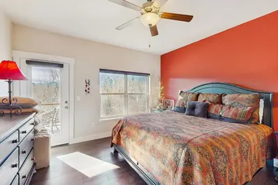 a bedroom with a bed and a ceiling fan at Lookout Point in Fraser