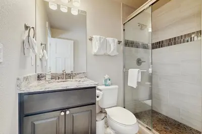 a bathroom with a toilet and a sink and a shower at Lookout Point in Fraser