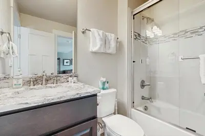 a bathroom with a sink and a toilet and a shower at Lookout Point in Fraser