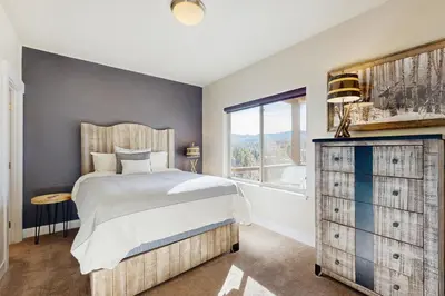 a bedroom with a large bed and a window at Lookout Point in Fraser