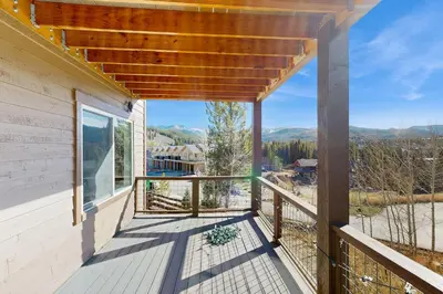 a balcony with a view of the mountains at Lookout Point in Fraser