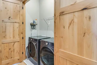a laundry room with a washer and dryer at 5 Mi to Winter Park Skiing and Dtwn Mtn-View Condo in Fraser