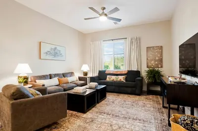a living room with a couch and a table at Heart of Gold-en - Walk Everywhere -Close to Red Rocks in Golden