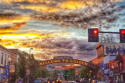 a street with a welcome to colombia sign and a traffic light at Heart of Gold-en - Walk Everywhere -Close to Red Rocks in Golden