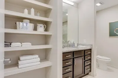 a white bathroom with a sink and a toilet at Heart of Gold-en - Walk Everywhere -Close to Red Rocks in Golden