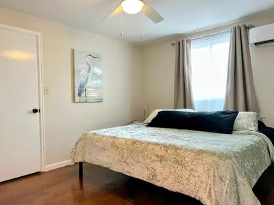 a bedroom with a bed and a window at Longmont board games, beds, and boats - 4BR in Longmont