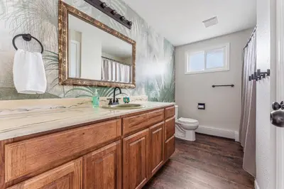 a bathroom with a sink and a mirror at Longmont board games, beds, and boats - 4BR in Longmont